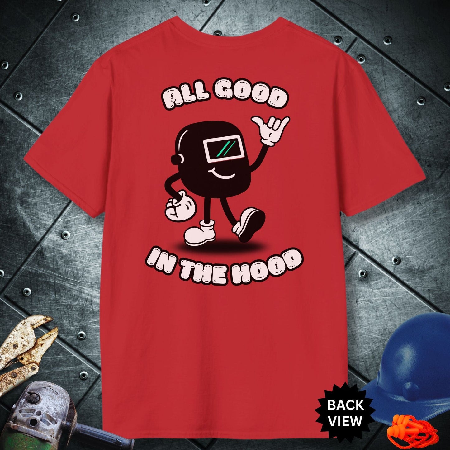 Red t-shirt with a graphic design and text 'All Good in the Hood' on a metallic surface.