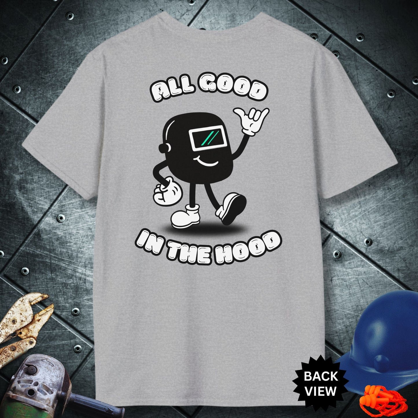 Grey t-shirt with a graphic design and text 'All Good in the Hood' on a metallic surface.