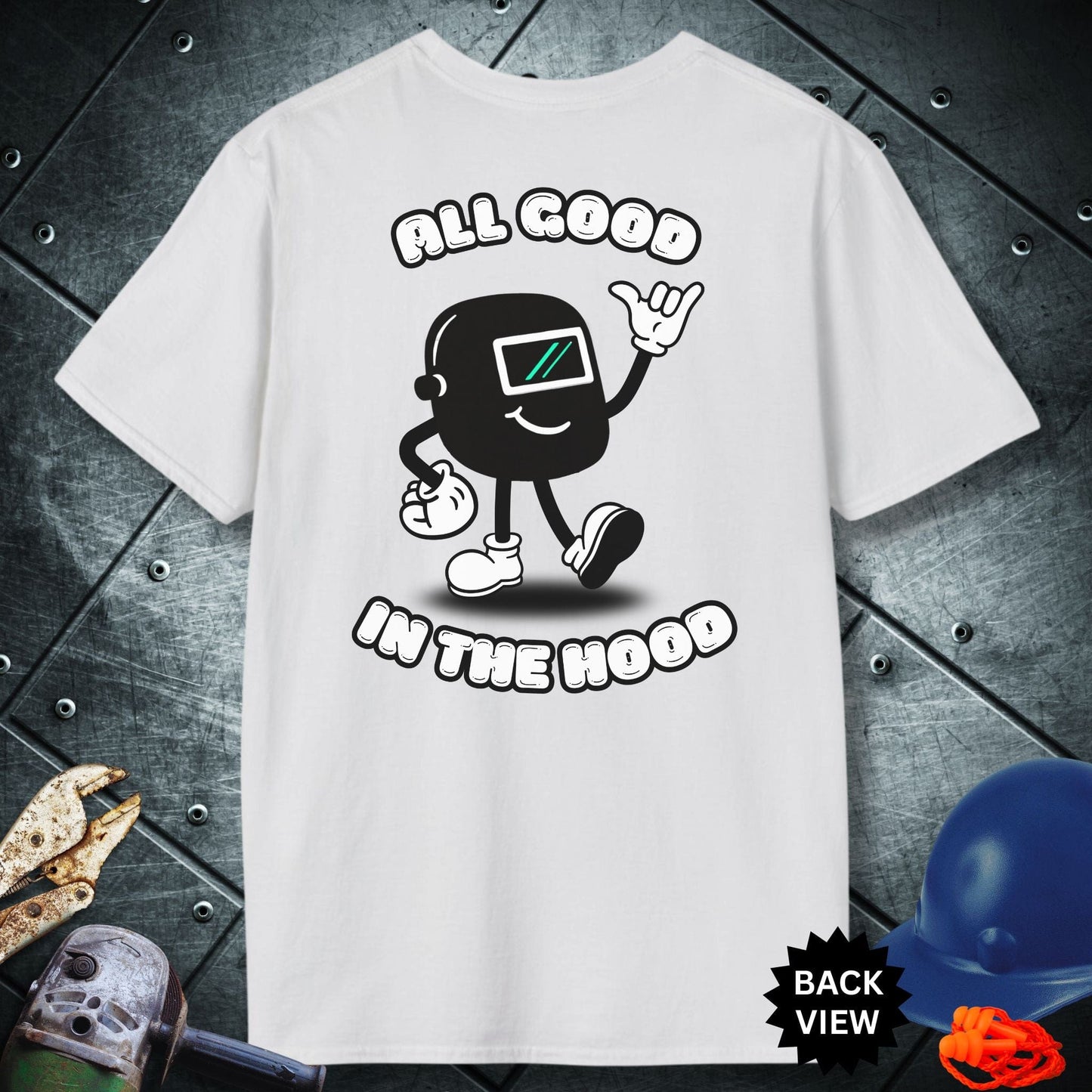 White t-shirt with a graphic design and text 'All Good in the Hood' on a metallic surface.