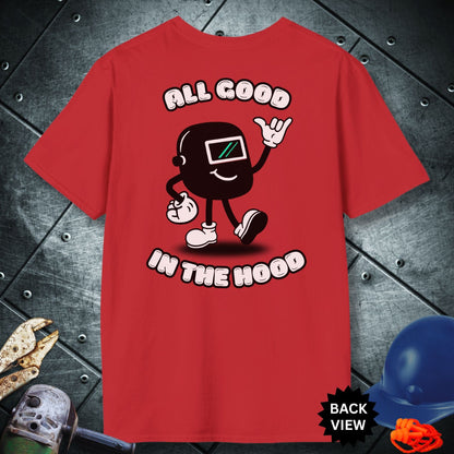 Red t-shirt with a graphic design and text 'All Good in the Hood' on a metallic surface.
